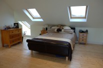 Loft conversion bedroom with Velux windows